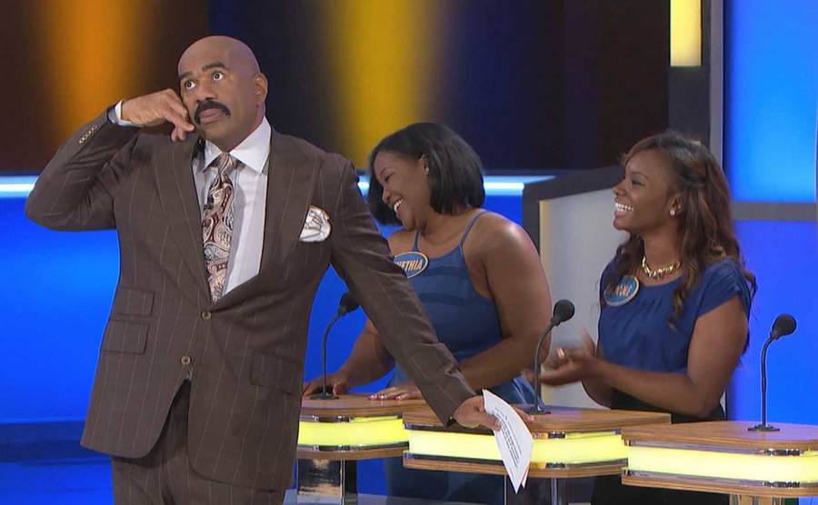 Steve Harvey pretends to take a phone call during the show.