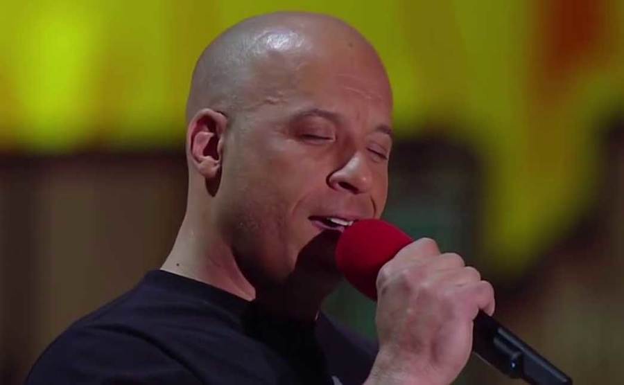 Vin Diesel is singing a song live. 