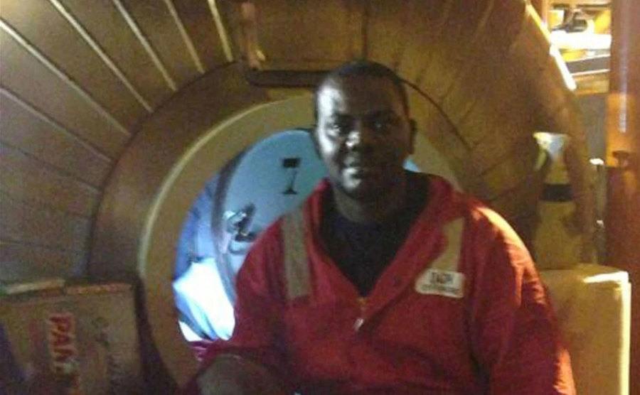 A dated portrait of Okene at work.