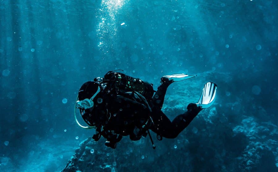An image of a man diving in the sea.