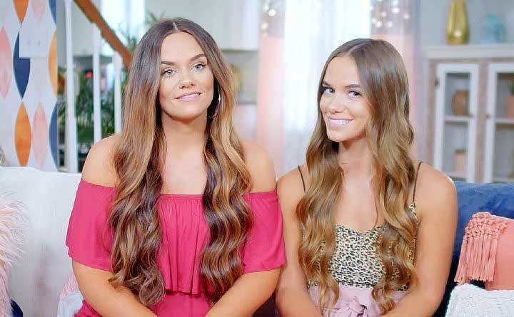 Brooke and Baylee talk on the couch.