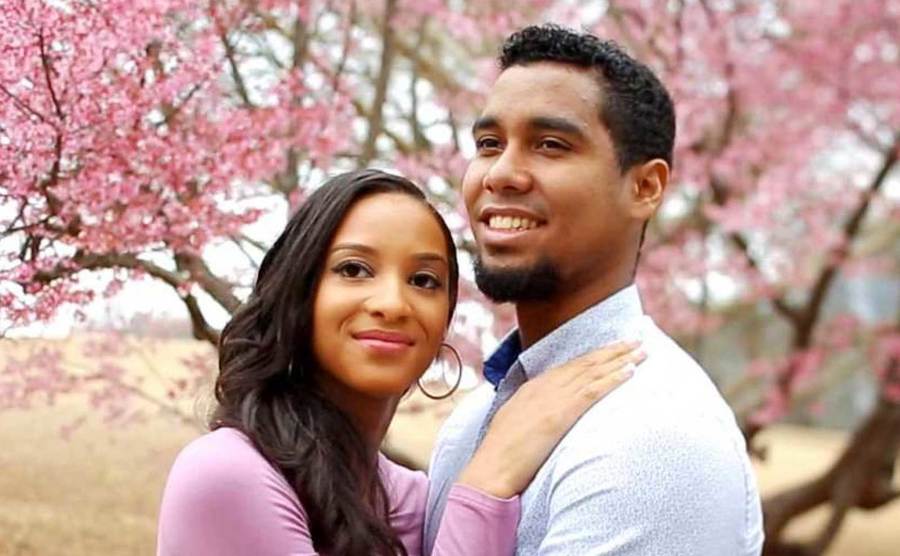 Chantel Everett and Pedro Jimeno pose amongst the cherry blossoms.
