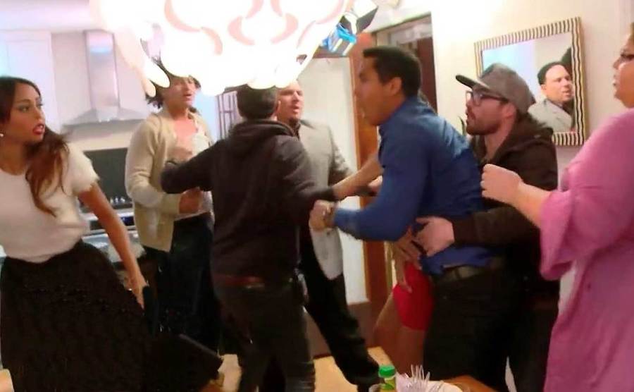 Crew and castmembers try to breakup the fight.