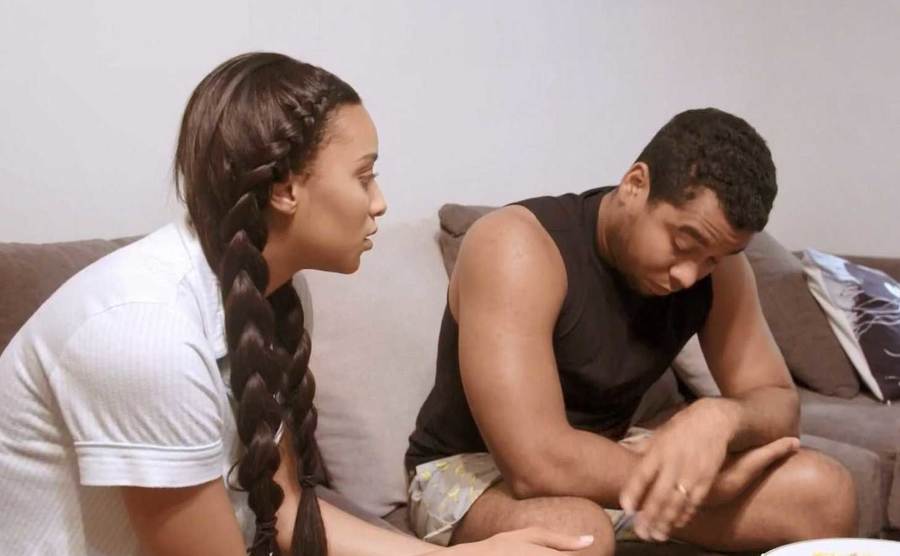 Chantel and Pedro are talking on the couch.
