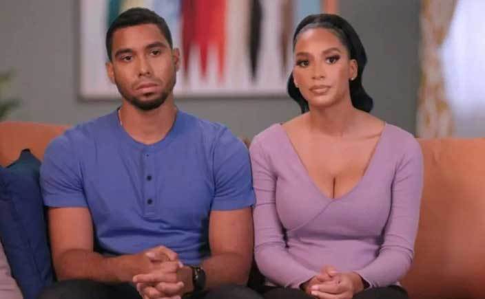 Pedro and Chantel sit on the couch.