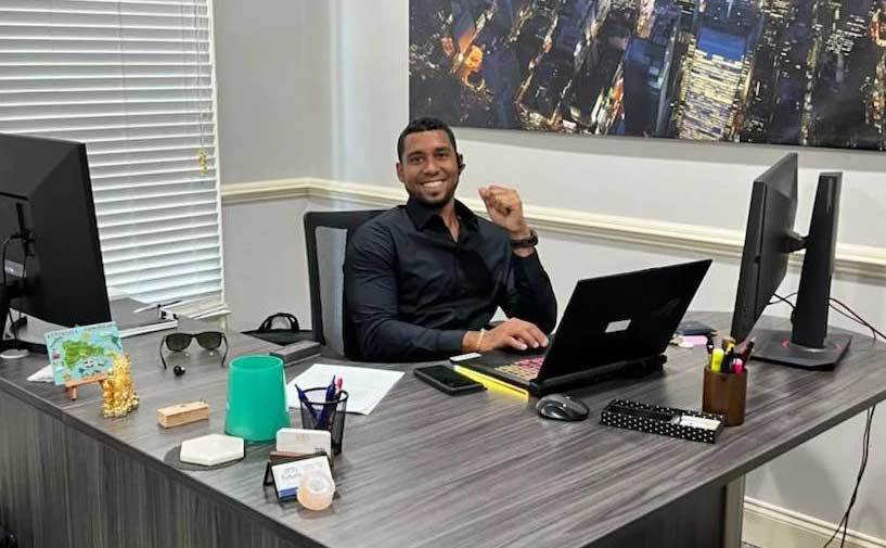 Pedro is working in his office.