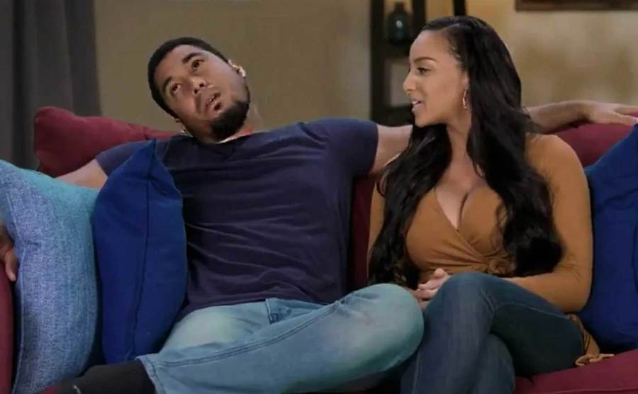 Chantel Everett and Pedro Jimeno talk on the couch.