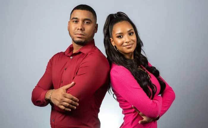 Chantel Everett and Pedro Jimeno pose back to back.