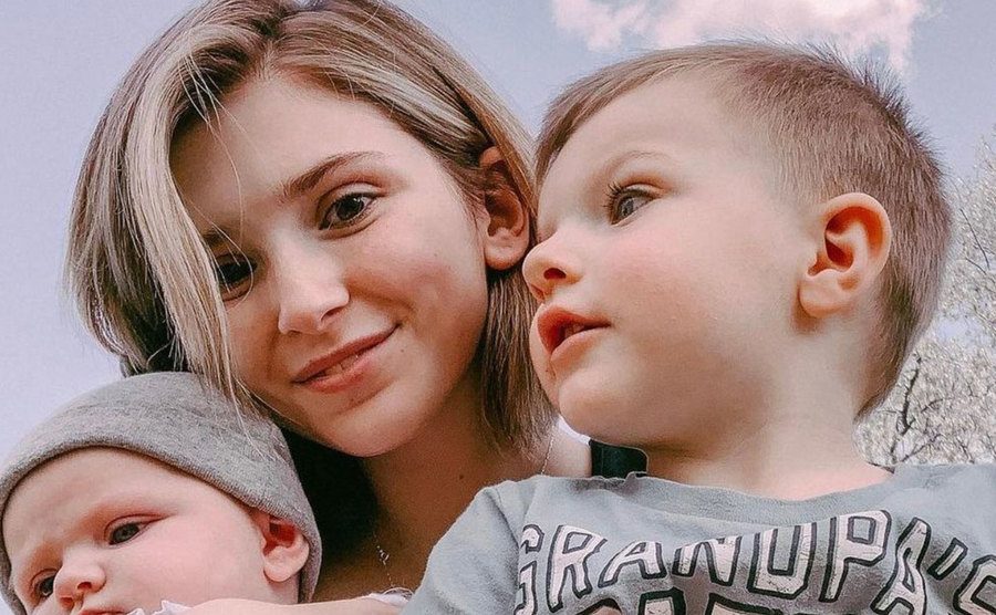 Adkins takes a picture with her children.