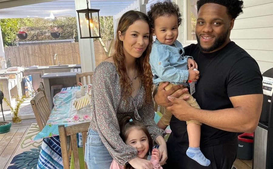 Bennett poses for a picture with her new boyfriend and children.