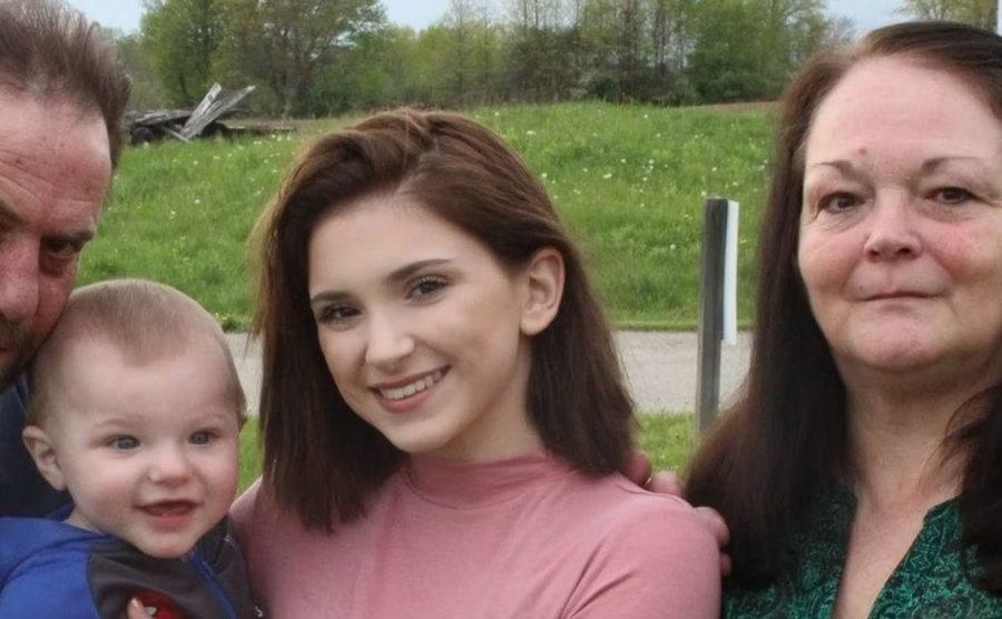 Adkins poses for a picture with her family.
