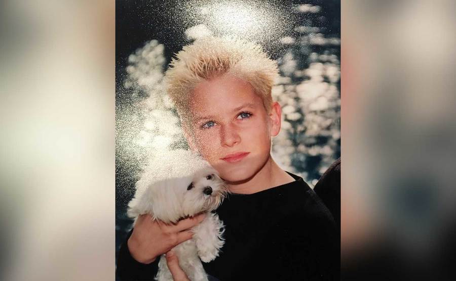 A photo of young Armie with a dog.