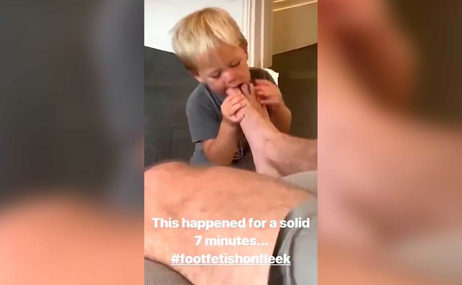 Hammer’s son is seen munching on his father’s toes.