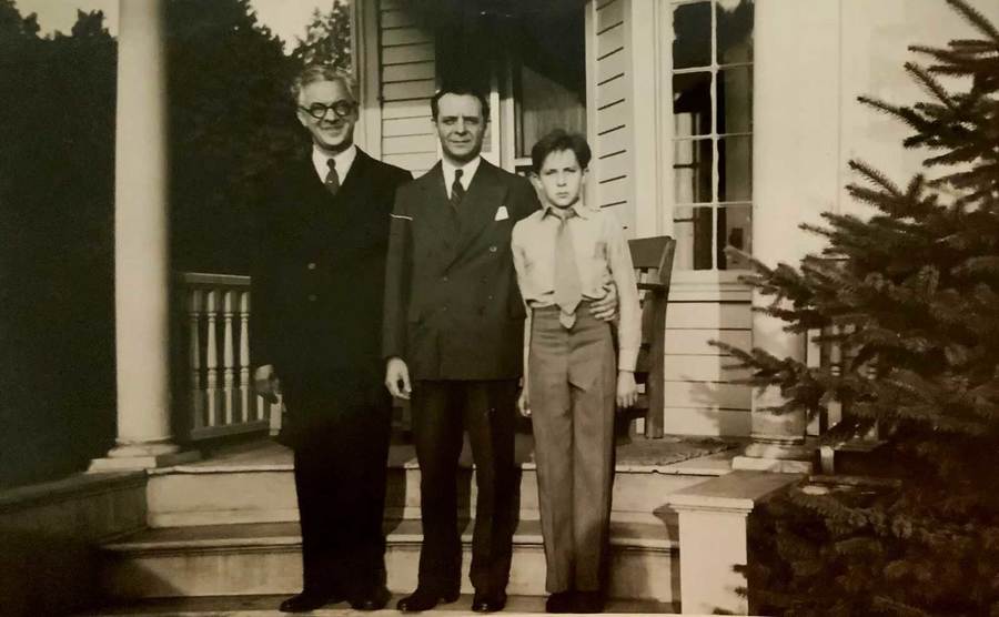 Julius, Armand, and Julian outside their home.