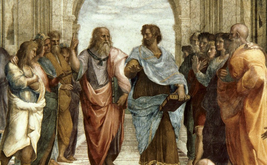 A painting of Plato and Aristotle discussing.