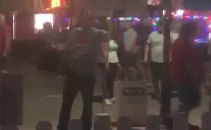 A screengrab of the man yelling at kids in the festival.