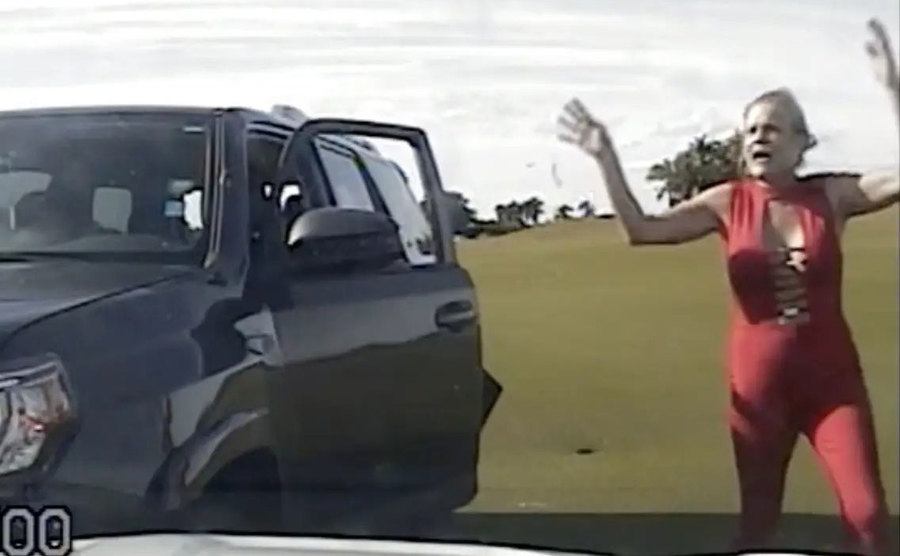 Jodie Ann Harvey walks out of her car after the police chased her.
