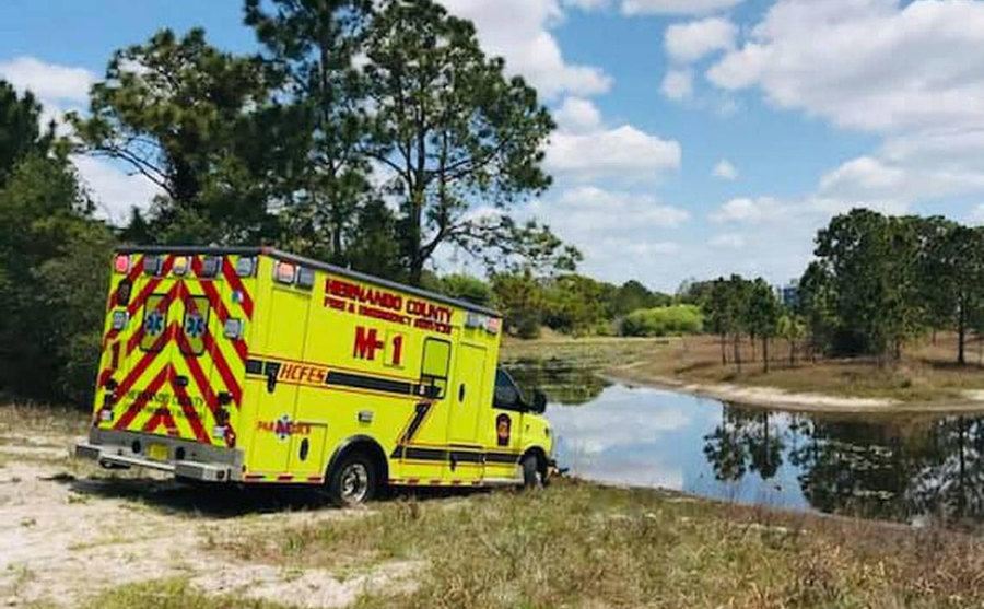 The ambulance left in the mud on the side of the road.