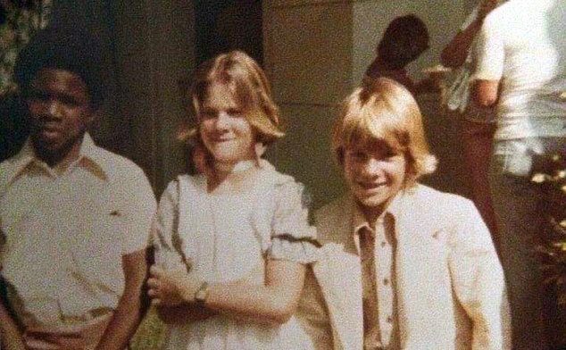 Booth poses with friends during his days in the honors program in school.
