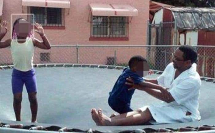 Booth is playing on the trampoline with his grandkids.