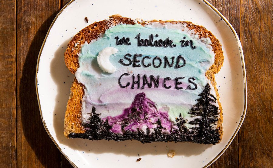 Bread art that says “we believe in second chances”