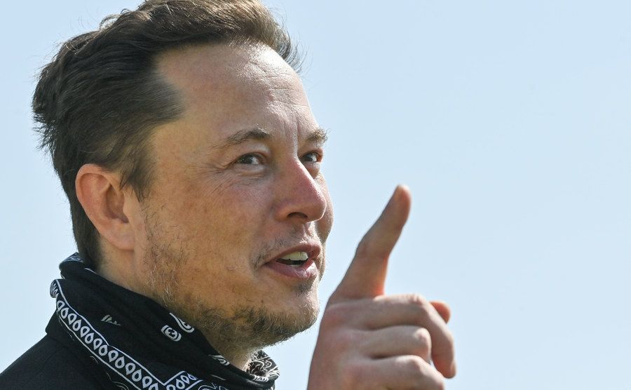Musk addresses the media.
