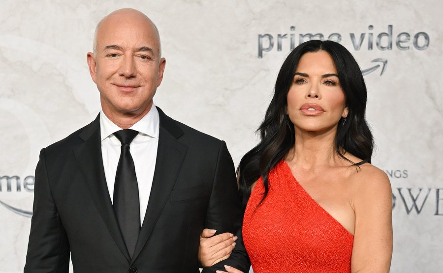 Bezos and Lauren Sanchez pose for the press.