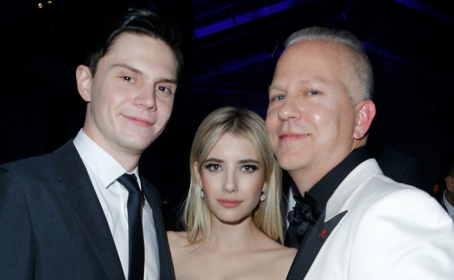 Evan Peters, Emma Roberts, and Ryan Murphy attend an event.