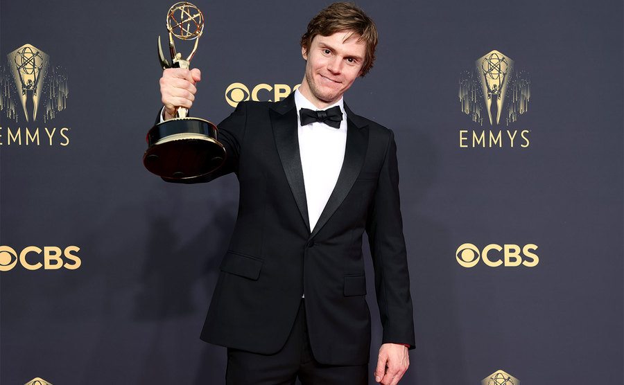 Peters shows off his Emmy Award.