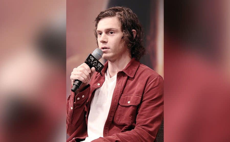 Evan Peters speaks during the press conference.