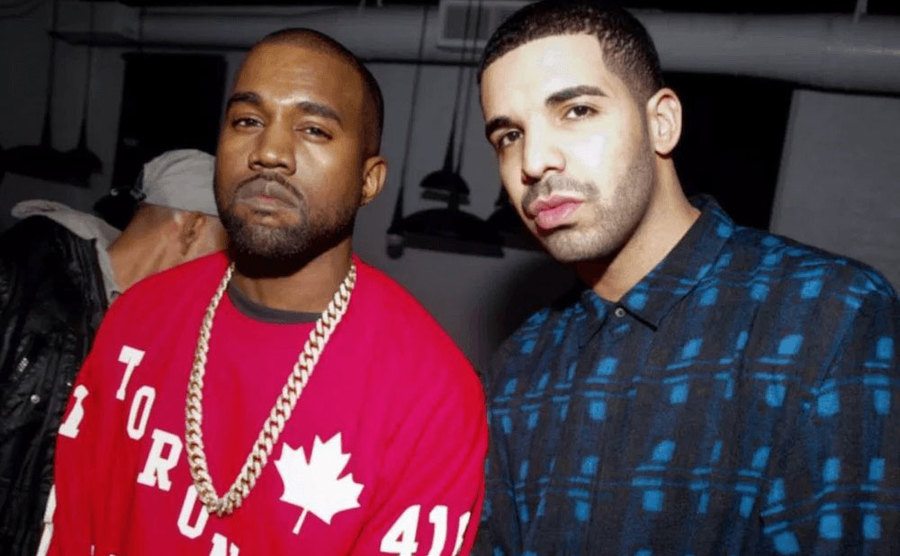 Kanye and Drake attend an event.