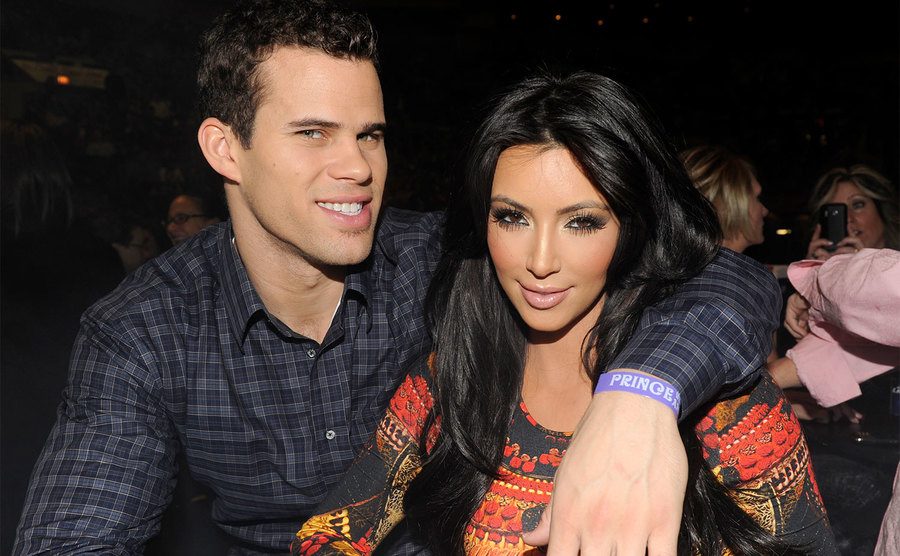 Kris Humphries and Kim Kardashian watch Prince perform.