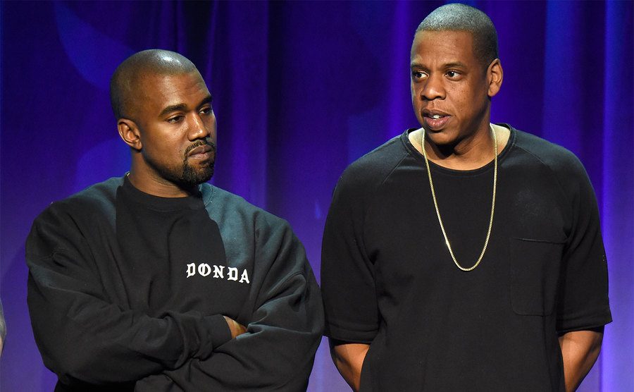 Kanye West and Jay Z attend an event.