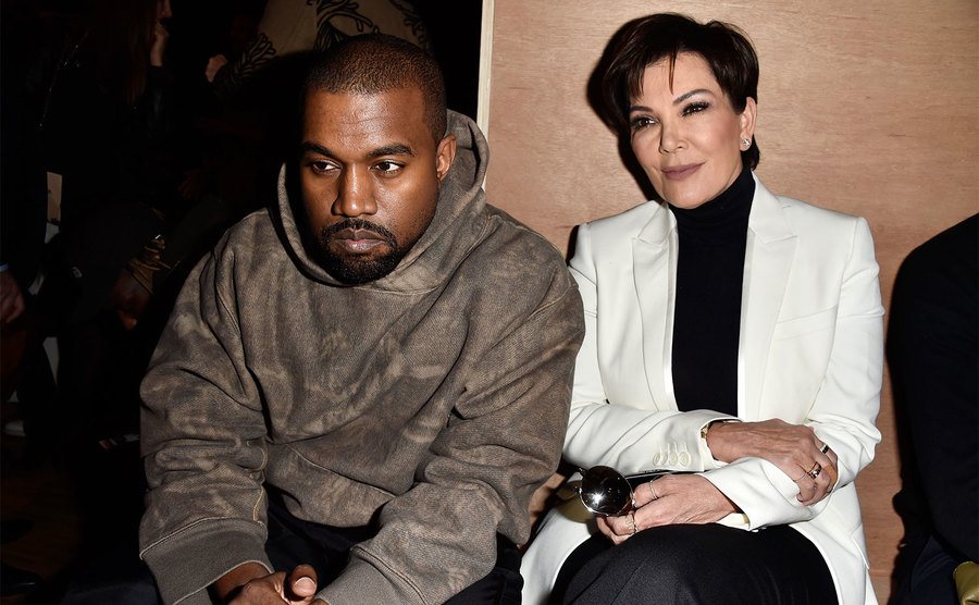 Kanye West and Kris Jenner attend the Givenchy show.