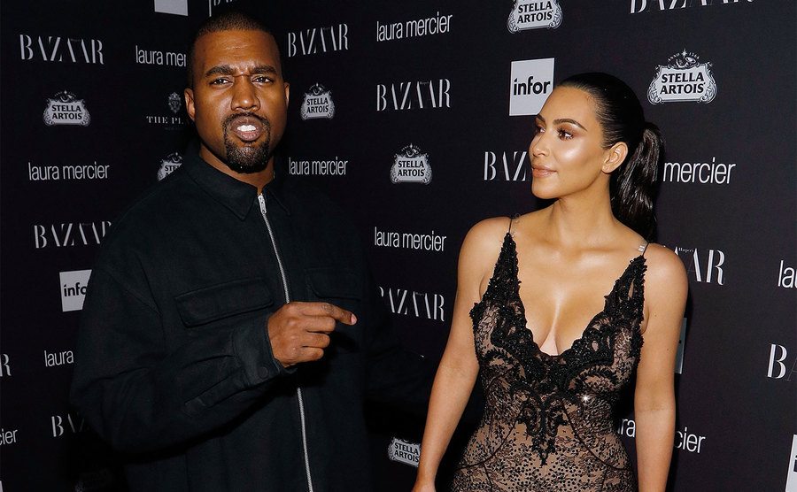 Kanye West and Kim Kardashian West attend an event.