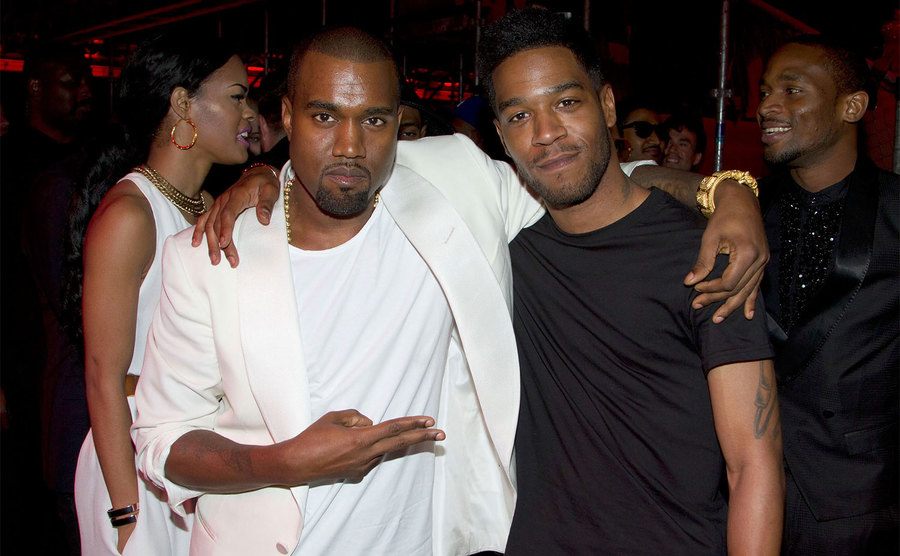 Kanye West and Kid Cudi attend an event.
