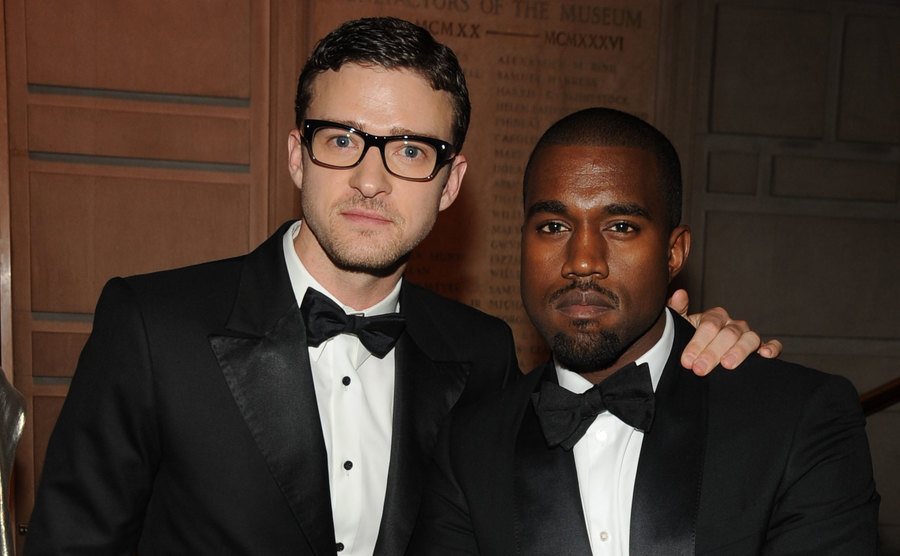 Justin Timberlake and Kanye West attend an event.