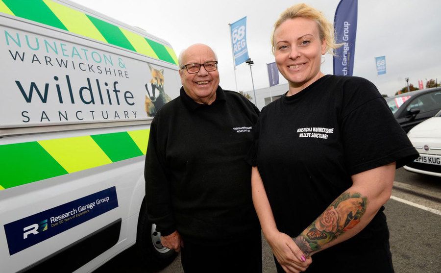 Geoff Grewcock and his daughter pose with the sanctuary van.