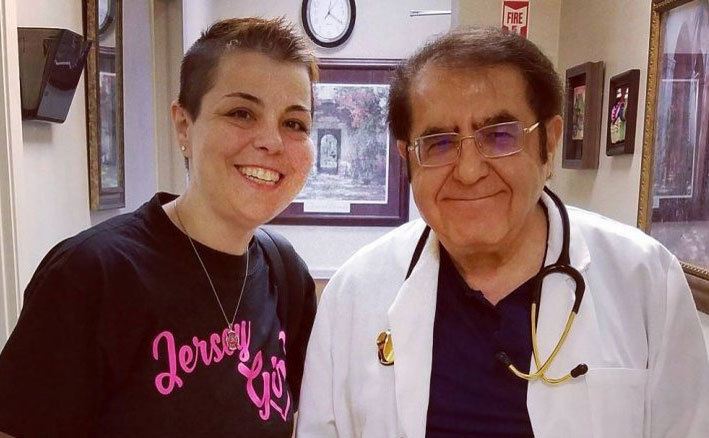 A woman poses with Dr. Now.