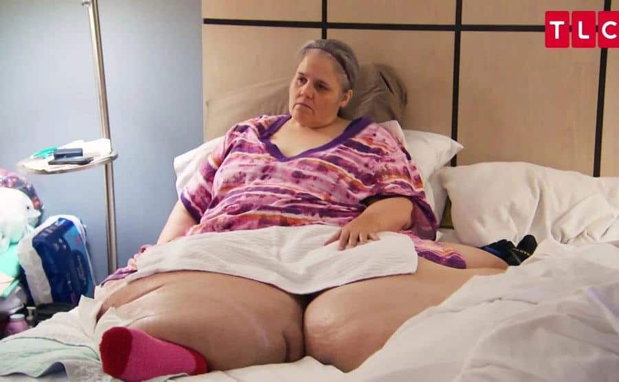 Tracey Matthews is sitting in a hospital bed.