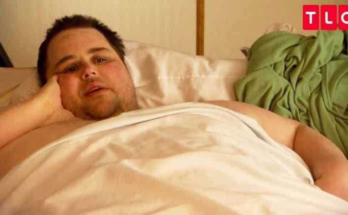 An obese man is telling his story to the camera.
