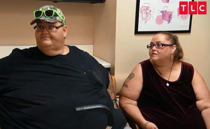 A couple from the show listen to the doctor.