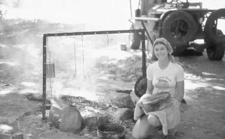 Joanne van Os is cooking dinner while on a camping trip.