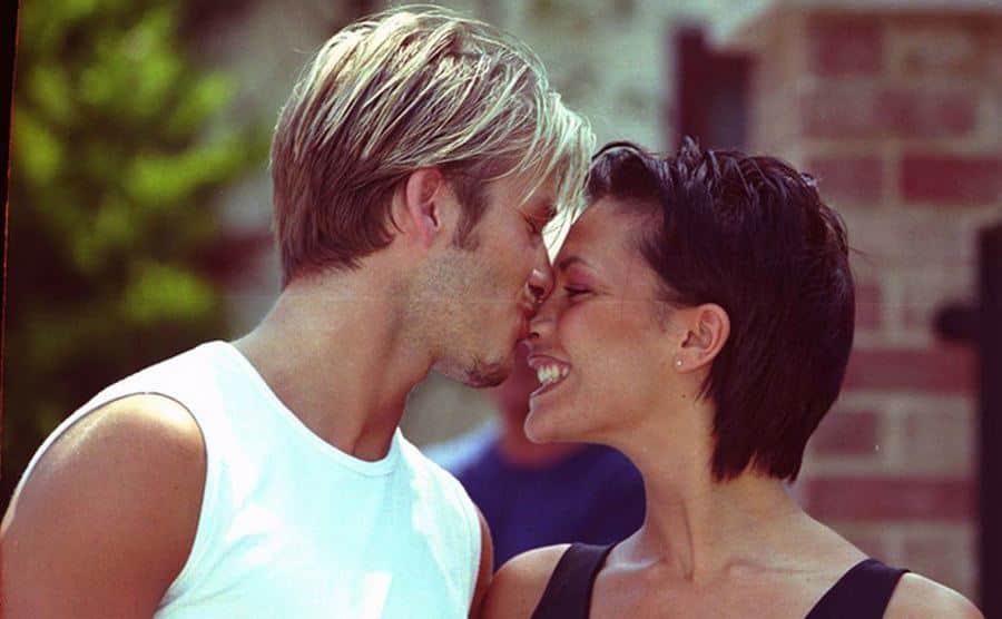 David kisses Victoria on the nose.