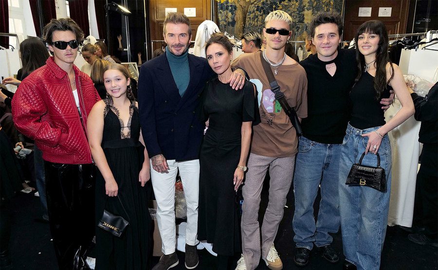 The Beckham family poses together.