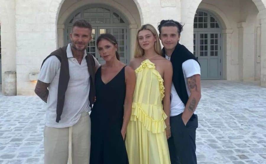 David, Victoria, Nicola, and Brooklyn take a photo together.