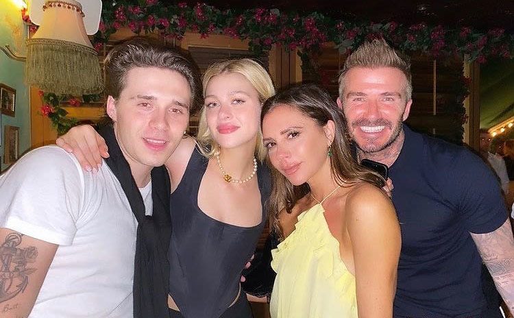Brooklyn, Nicola, Victoria, and David pose together.