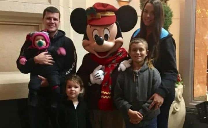 Natasha, Chris and their kids are at Disneyland.