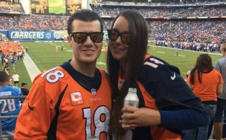Chris and Natasha attend a football game.