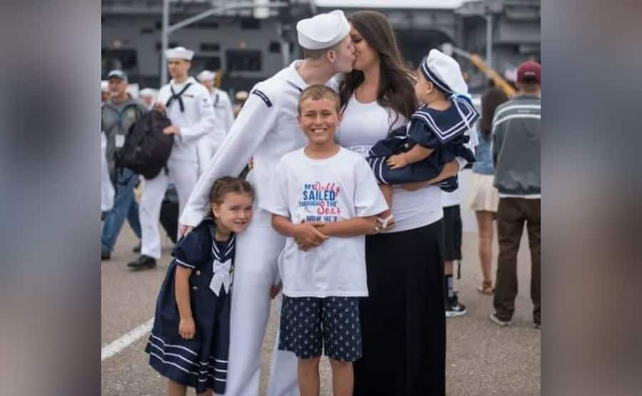 A family photo of Natasha, Chris, and the kids.